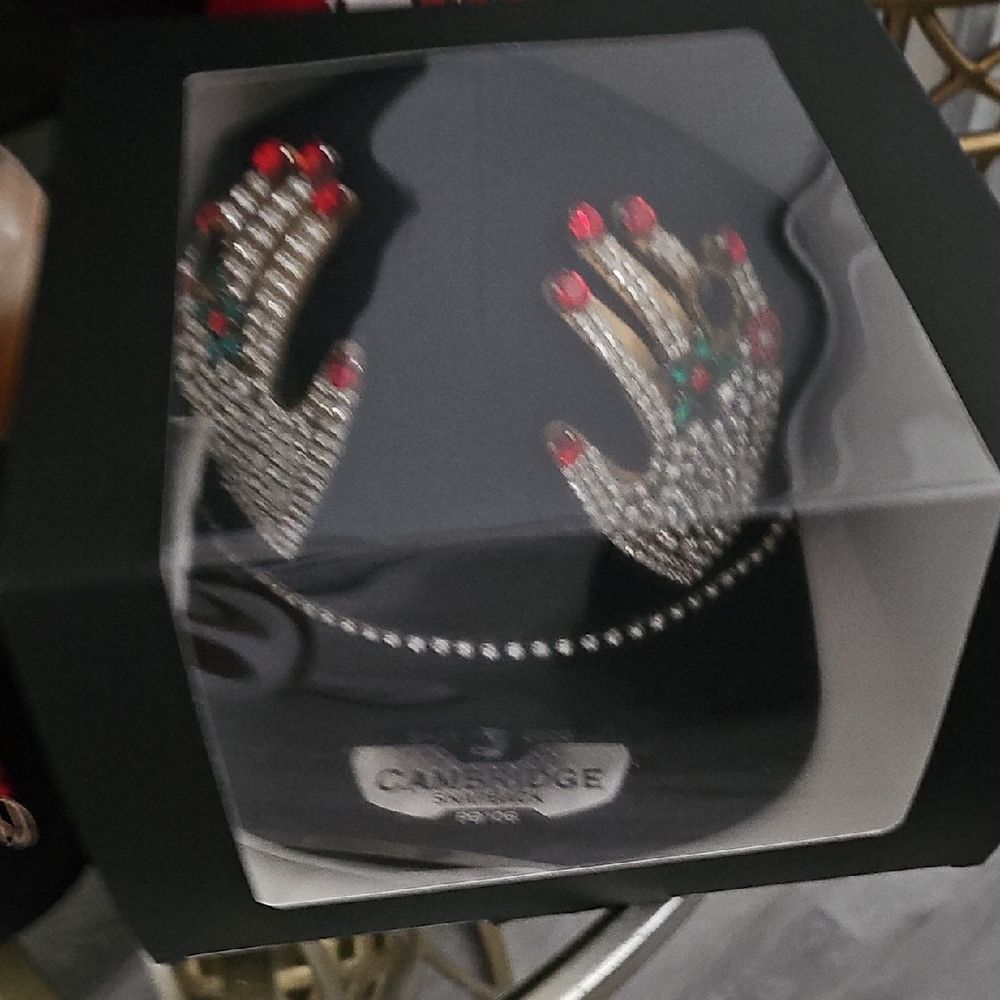 Swarovski Crystal Hand Display with Red and Green Accents